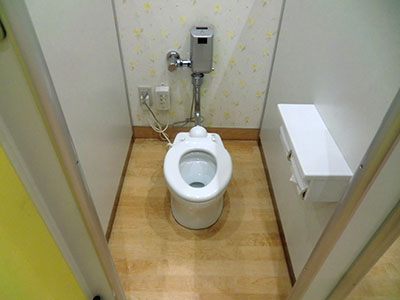 There are children's toilets and one of the three small Western-style toilets has a baby seat near the toilet. There is also a changing area.